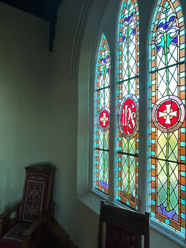 Stained glass window in the chapel, at the Convent at Koroit. Featuring intricate designs and vibrant colors that illuminate the sacred space with a sense of spiritual beauty and reverence.