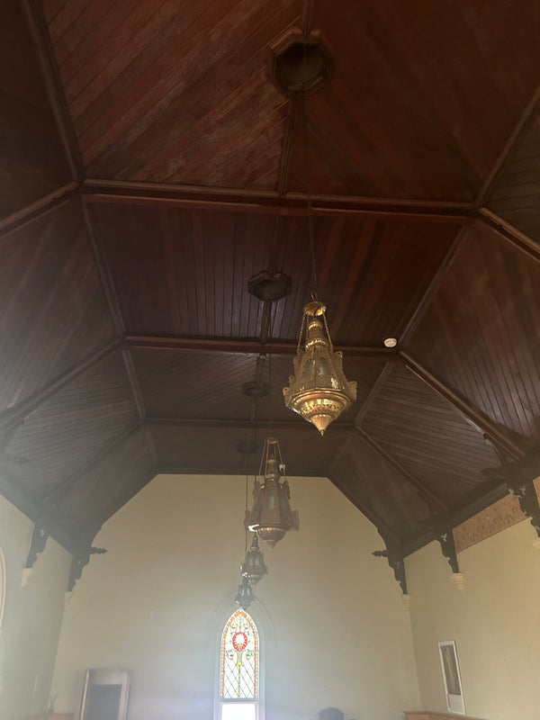 "Wooden ceiling in The Nun's Chapel at the Convent at Koroit, featuring exposed beams and perfect craftsmanship. This beautifully crafted wooden ceiling adds warmth and historic charm to the chapel, enhancing its serene and spiritual atmosphere."