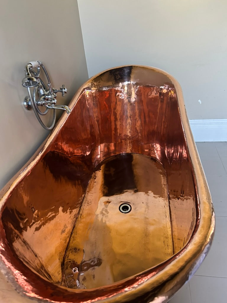 Indulge in luxury with our handcrafted copper bath at the Convent at Koroit. This elegant, deep soaking tub offers a relaxing escape, blending timeless design with modern comfort. Perfect for unwinding after a day exploring our serene gardens, the copper bath provides a unique and rejuvenating experience for our guests