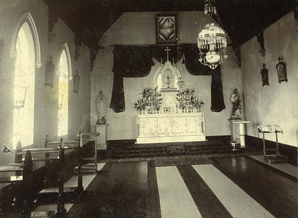 Interior view of the Koroit Convent chapel from 1910, showcasing its historic architecture, detailed woodwork, and traditional religious furnishings that reflect the period's spiritual atmosphere.