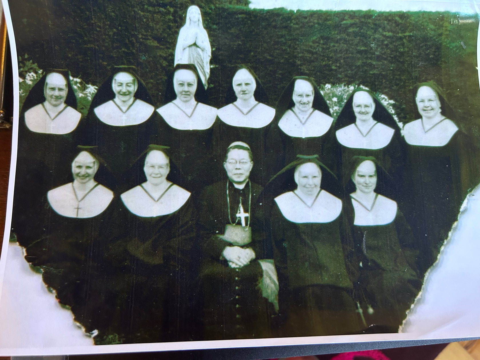 "Group of nuns from St. Patrick's Convent at Koroit, gathered together in their traditional habits, representing their dedication to education and service in the community."