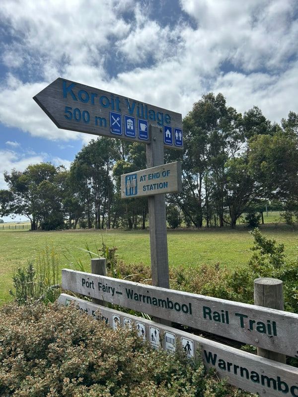 "The Rail Trail featuring a fantastic bicycle track leading to Port Fairy, with the disused train line running alongside. The old station and a nearby barbecue area are available for visitors, offering a perfect spot to relax and enjoy the historic setting."