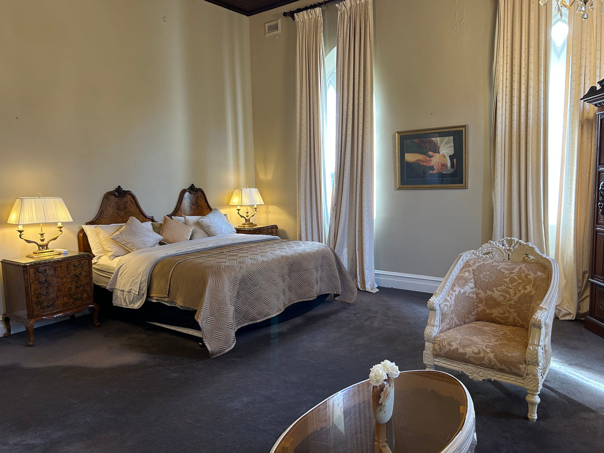 Sister Leone's Room at The Convent at Koroit. View of the bed and chair.