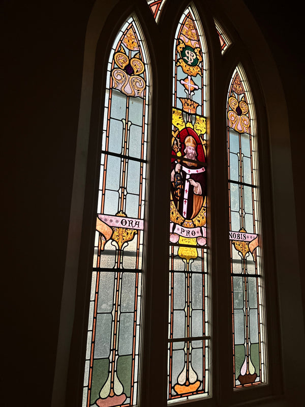 A stain glass window located along the stairs at the Convent at Koroit.